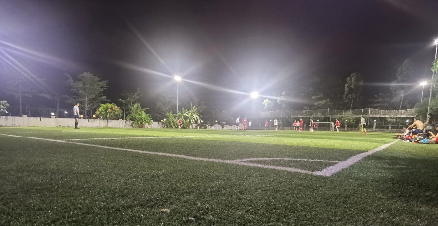 Floodlit match in progress at night